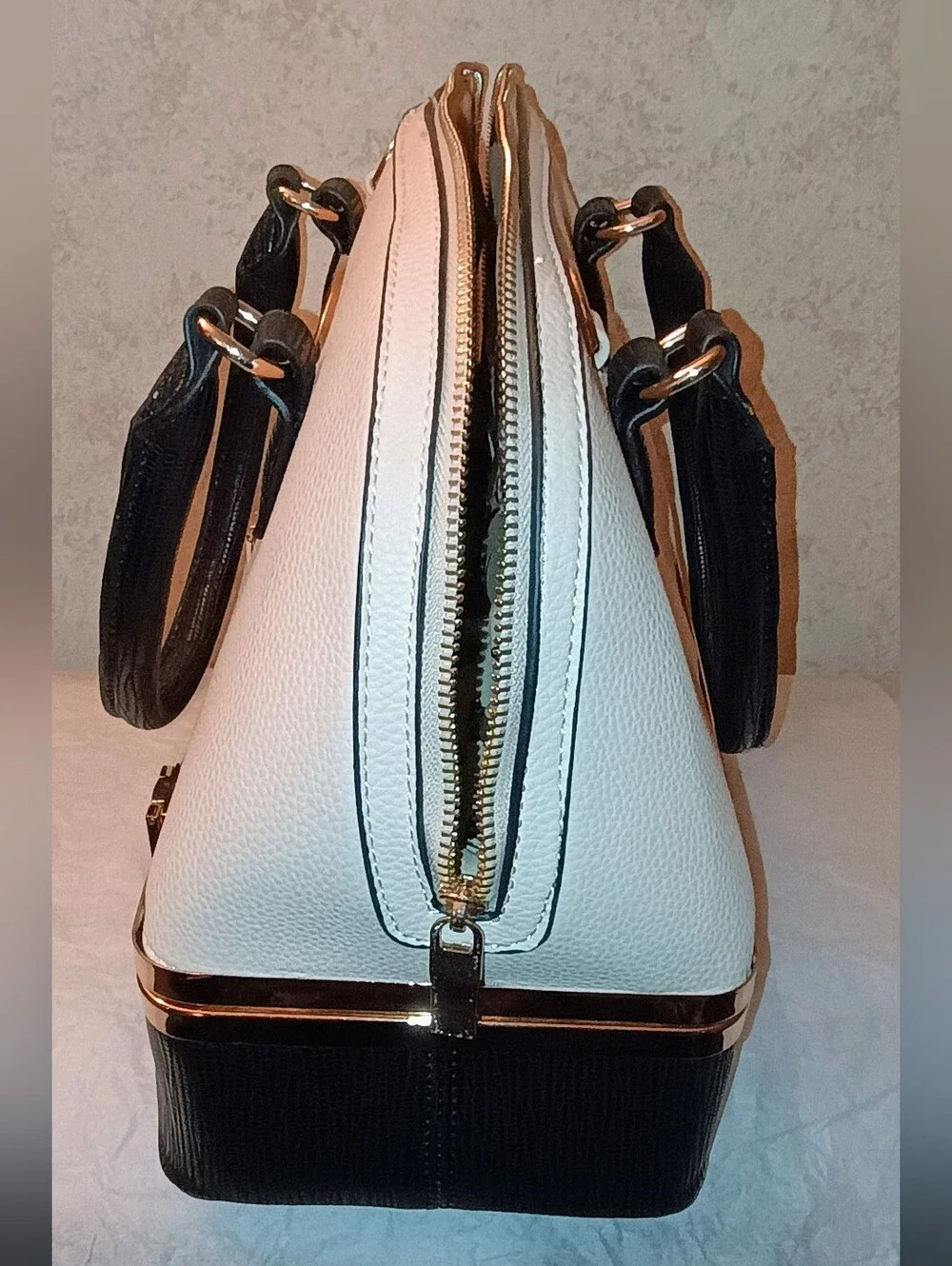 Elegant Two-Tone Black and Cream Dome Satchel